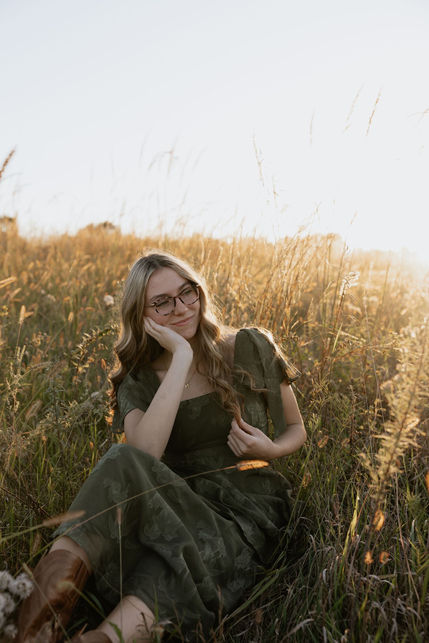 A dreamy autumn scene in a golden field during sunset.