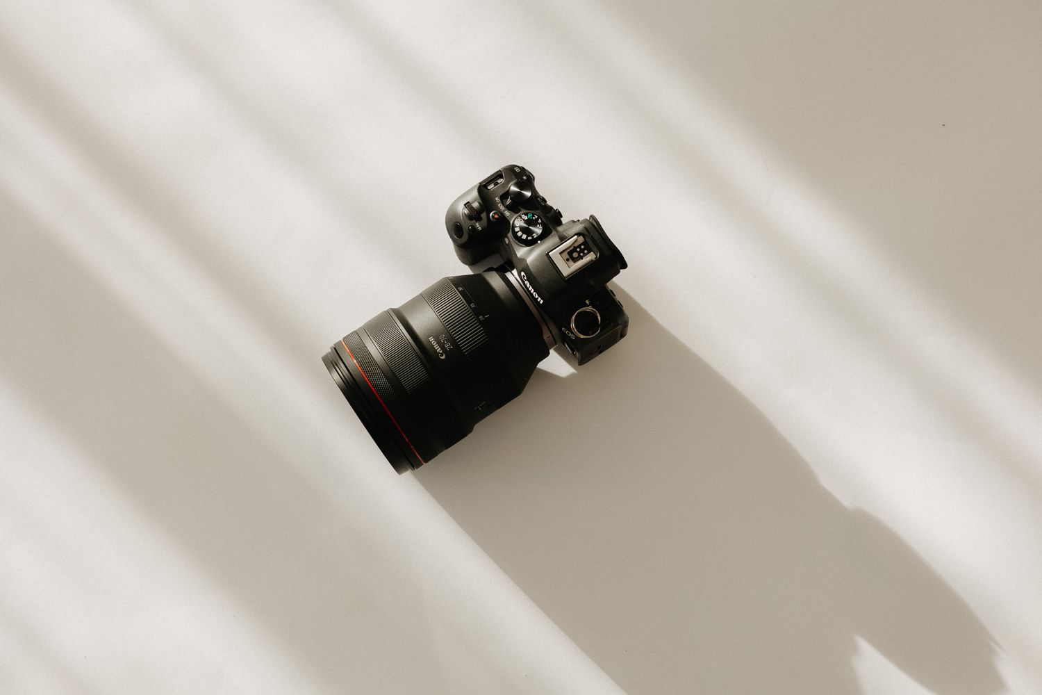 Aerial shot of camera arranged in diagonal line against white background.