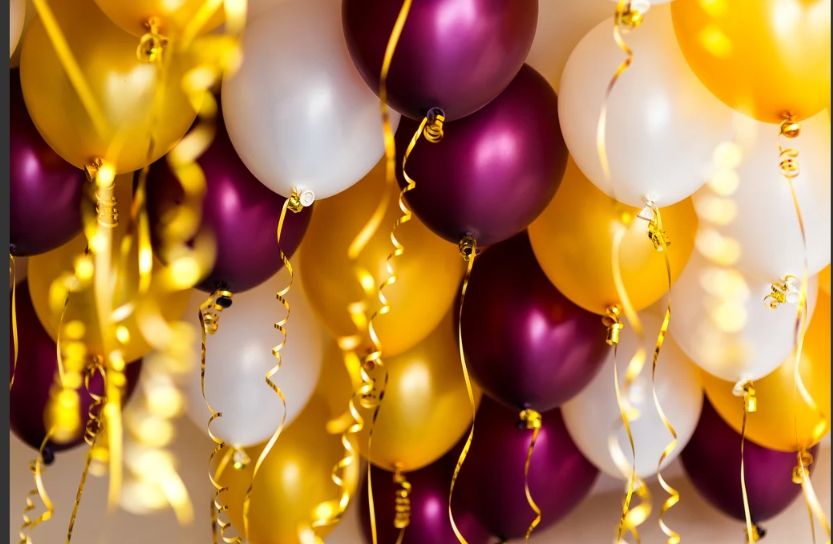 Festive gold, purple and white balloons with glowing lights create an elegant party atmosphere.