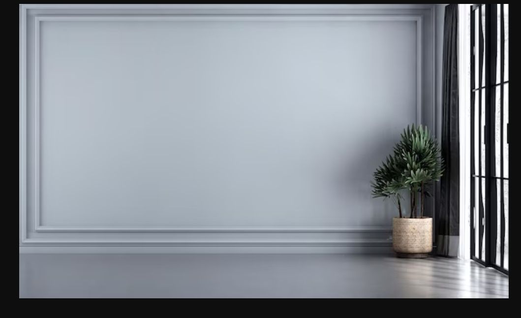 Modern white living room interior with large windows, gray walls, and crown molding details.