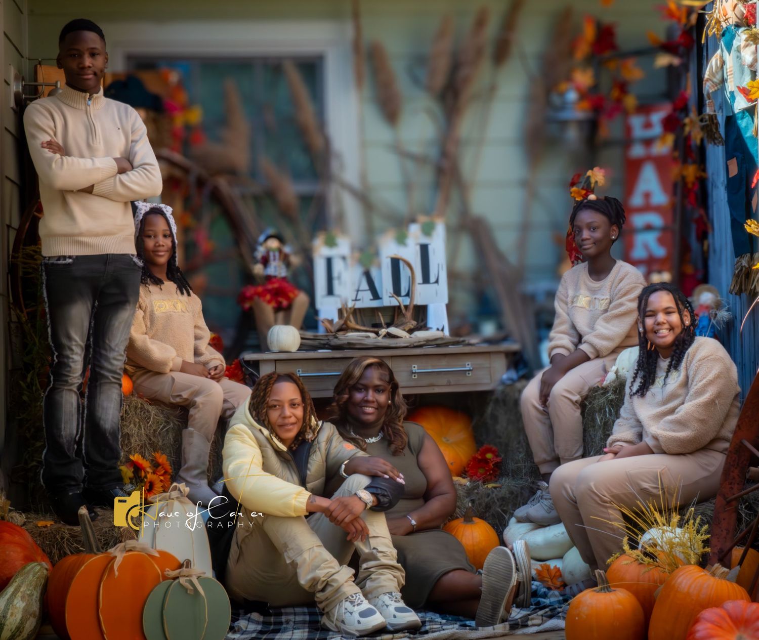 Casual outdoor gathering with pumpkins and autumn decorations on display.