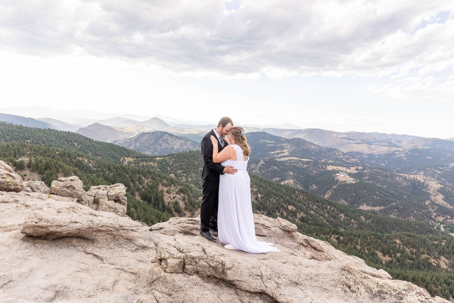 Couple eloping in Colorado surrounded by breathtaking mountain views, vibrant landscapes, and intimate moments