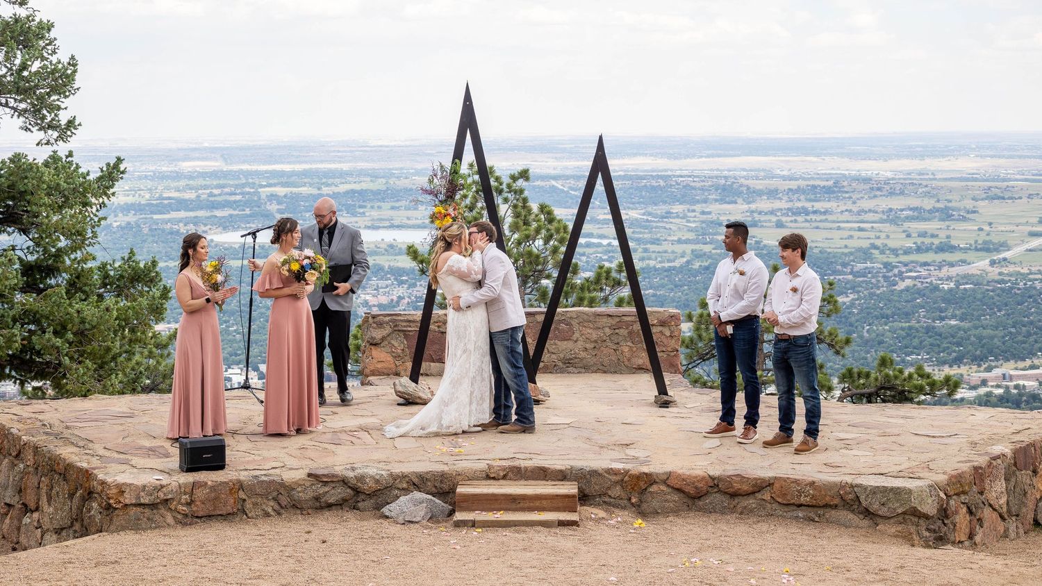 Couple eloping in Colorado surrounded by breathtaking mountain views, vibrant landscapes, and intimate moments