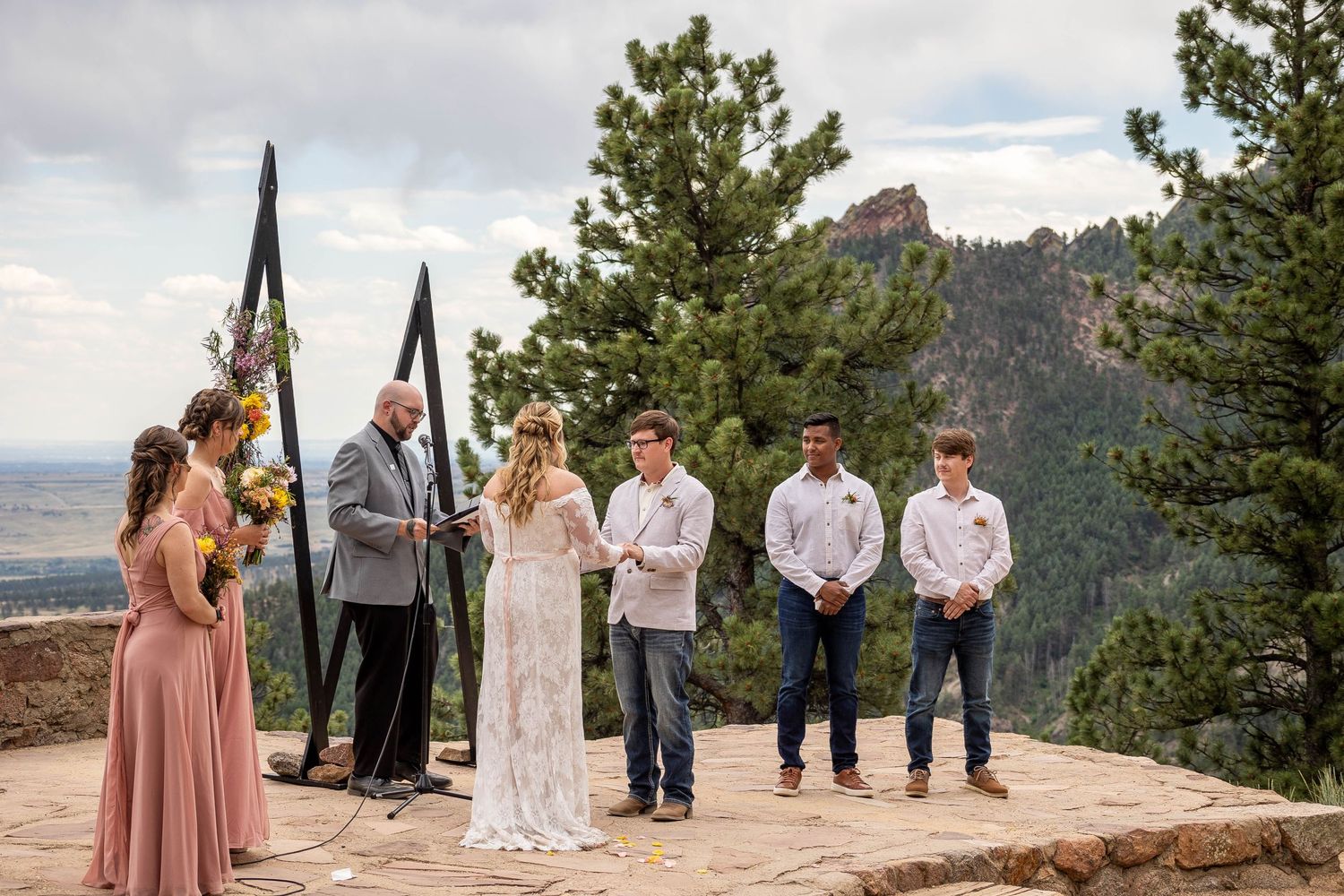 Couple eloping in Colorado surrounded by breathtaking mountain views, vibrant landscapes, and intimate moments