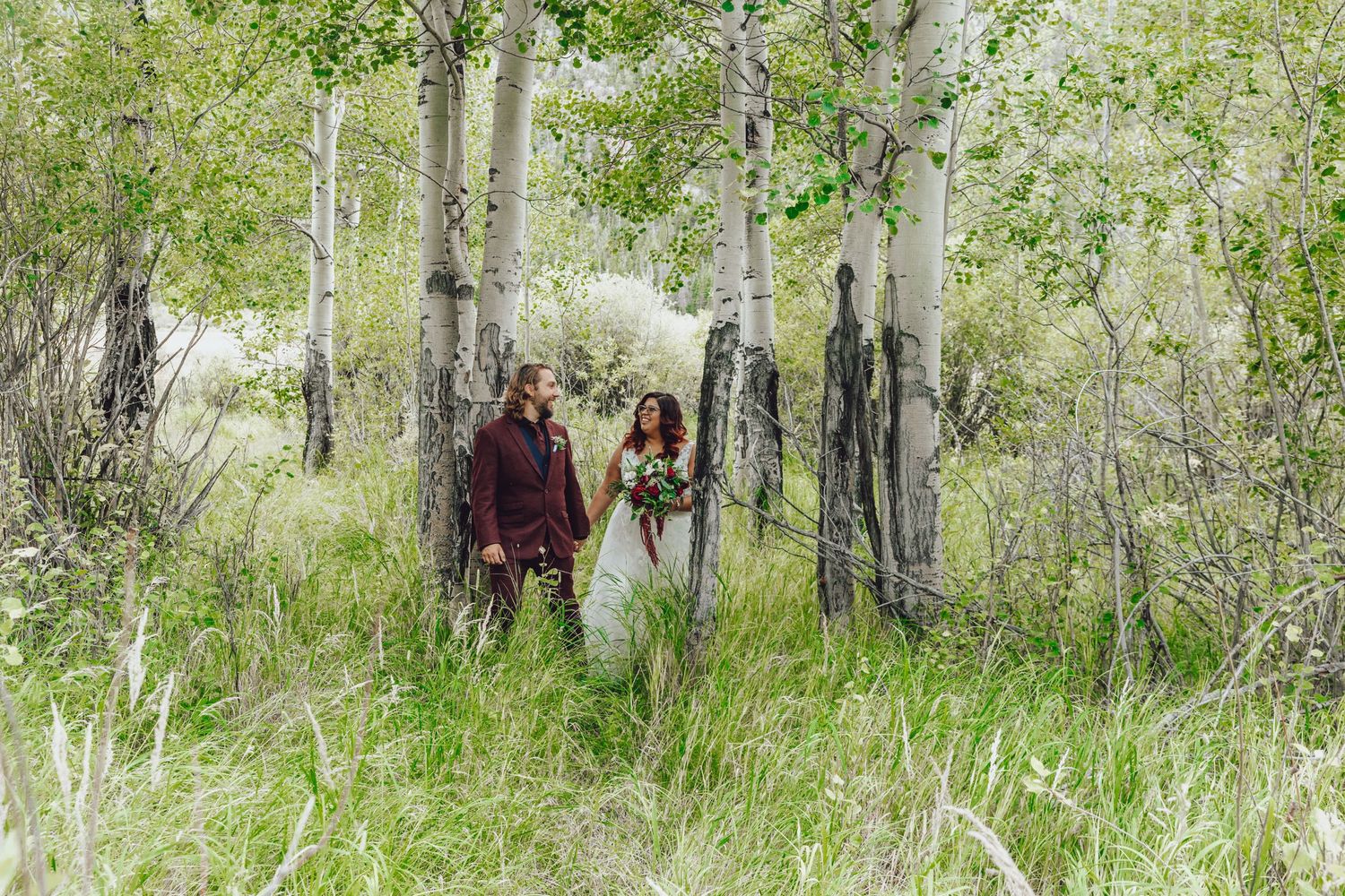 Couple eloping in Colorado surrounded by breathtaking mountain views, vibrant landscapes, and intimate moments