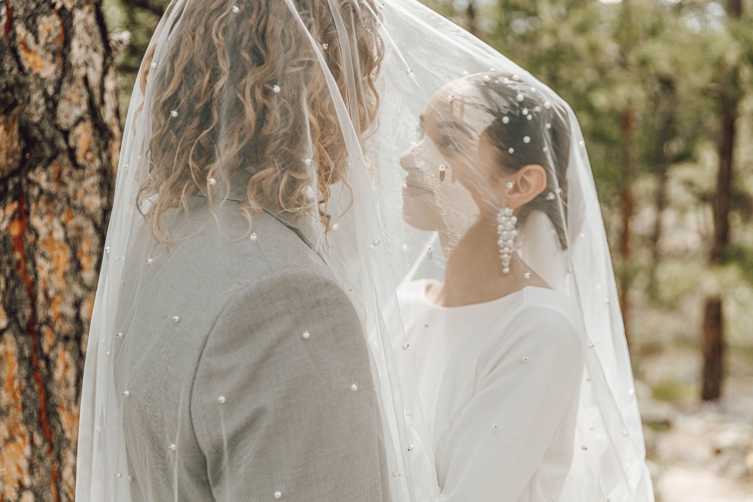 Couple eloping in Colorado surrounded by breathtaking mountain views, vibrant landscapes, and intimate moments