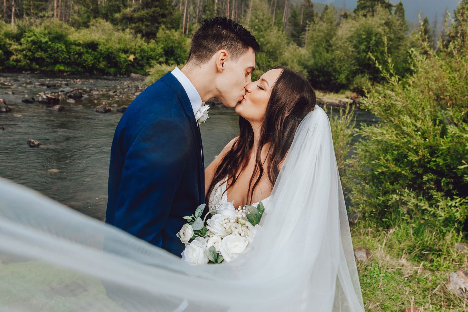 Couple eloping in Colorado surrounded by breathtaking mountain views, vibrant landscapes, and intimate moments