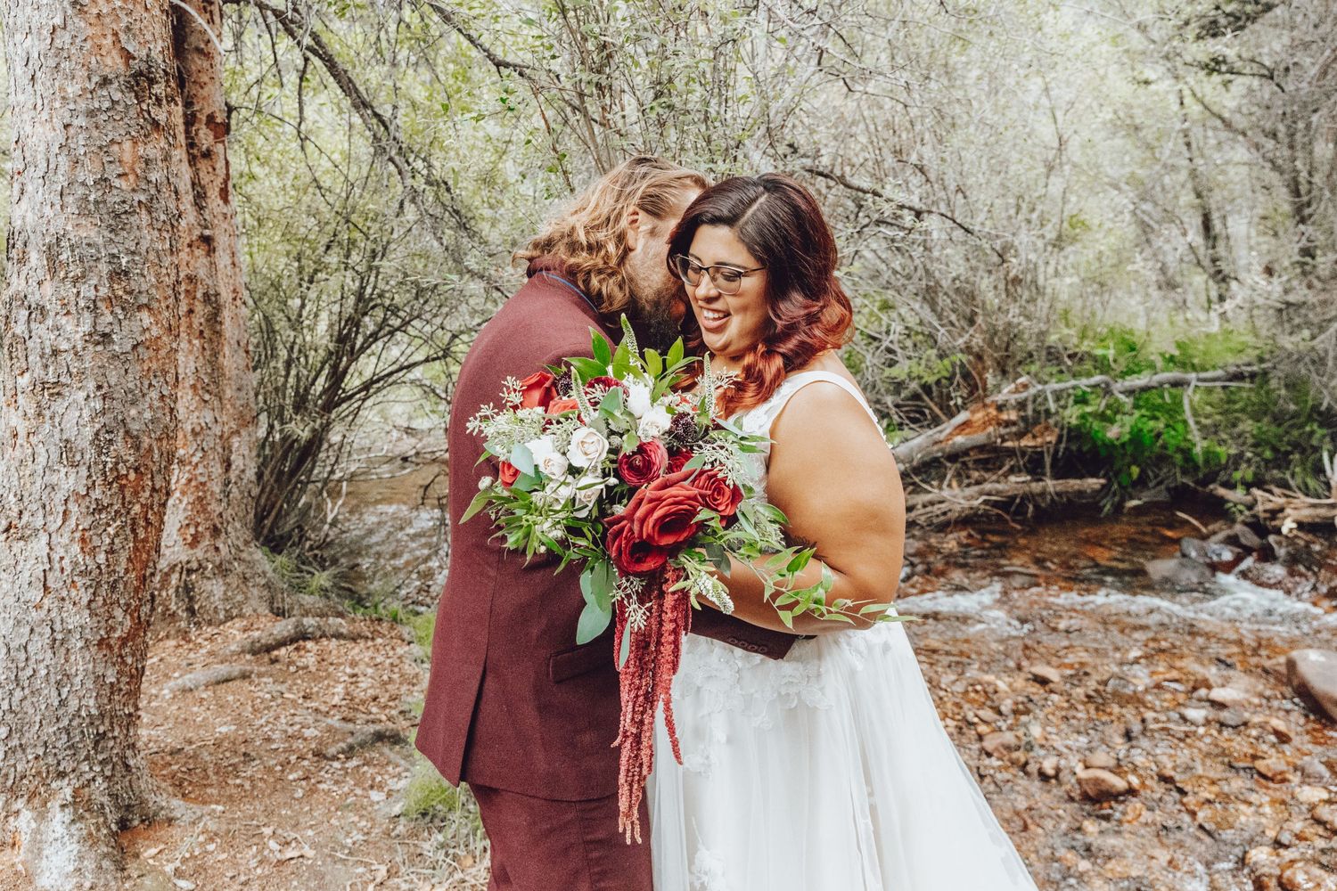Couple eloping in Colorado surrounded by breathtaking mountain views, vibrant landscapes, and intimate moments