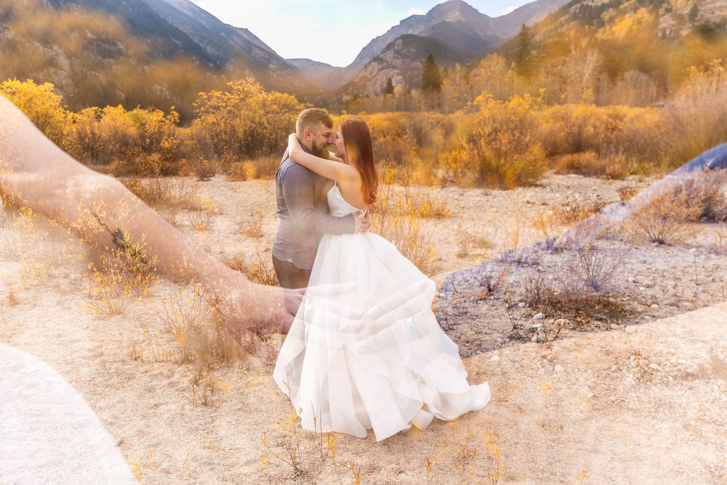 A romantic photoshoot in a golden mountain valley during fall season.