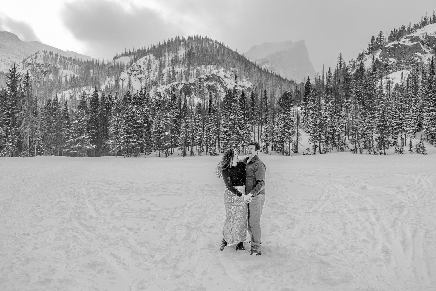 A series of snowy mountain landscape photos showing winter activities and scenic views of snow-covered peaks and forests.