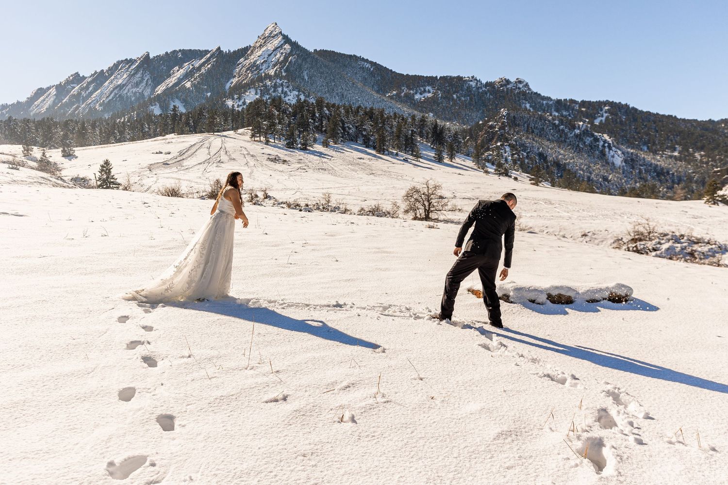 Couple eloping in Colorado surrounded by breathtaking mountain views, vibrant landscapes, and intimate moments