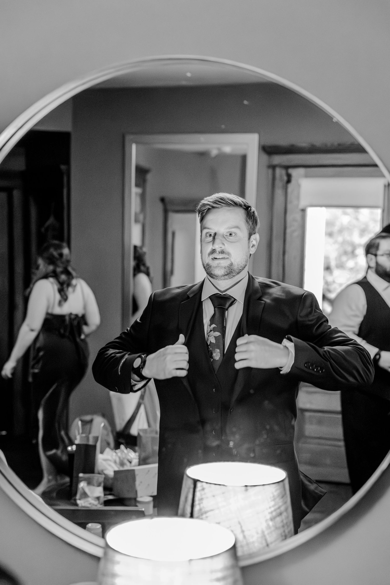 A black and white photo sequence showing someone making silly expressions through a curved mirror or window frame.