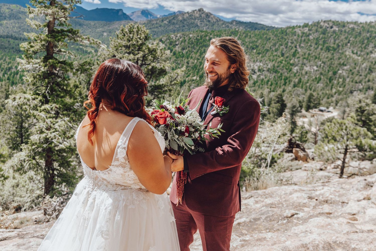 Couple eloping in Colorado surrounded by breathtaking mountain views, vibrant landscapes, and intimate moments