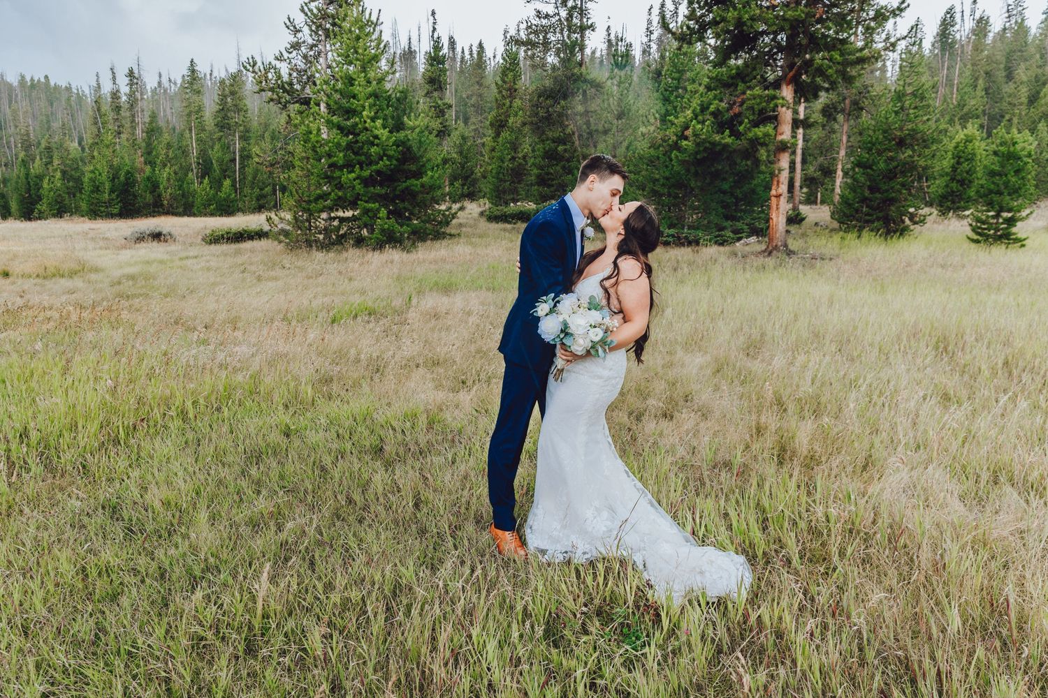 Couple eloping in Colorado surrounded by breathtaking mountain views, vibrant landscapes, and intimate moments