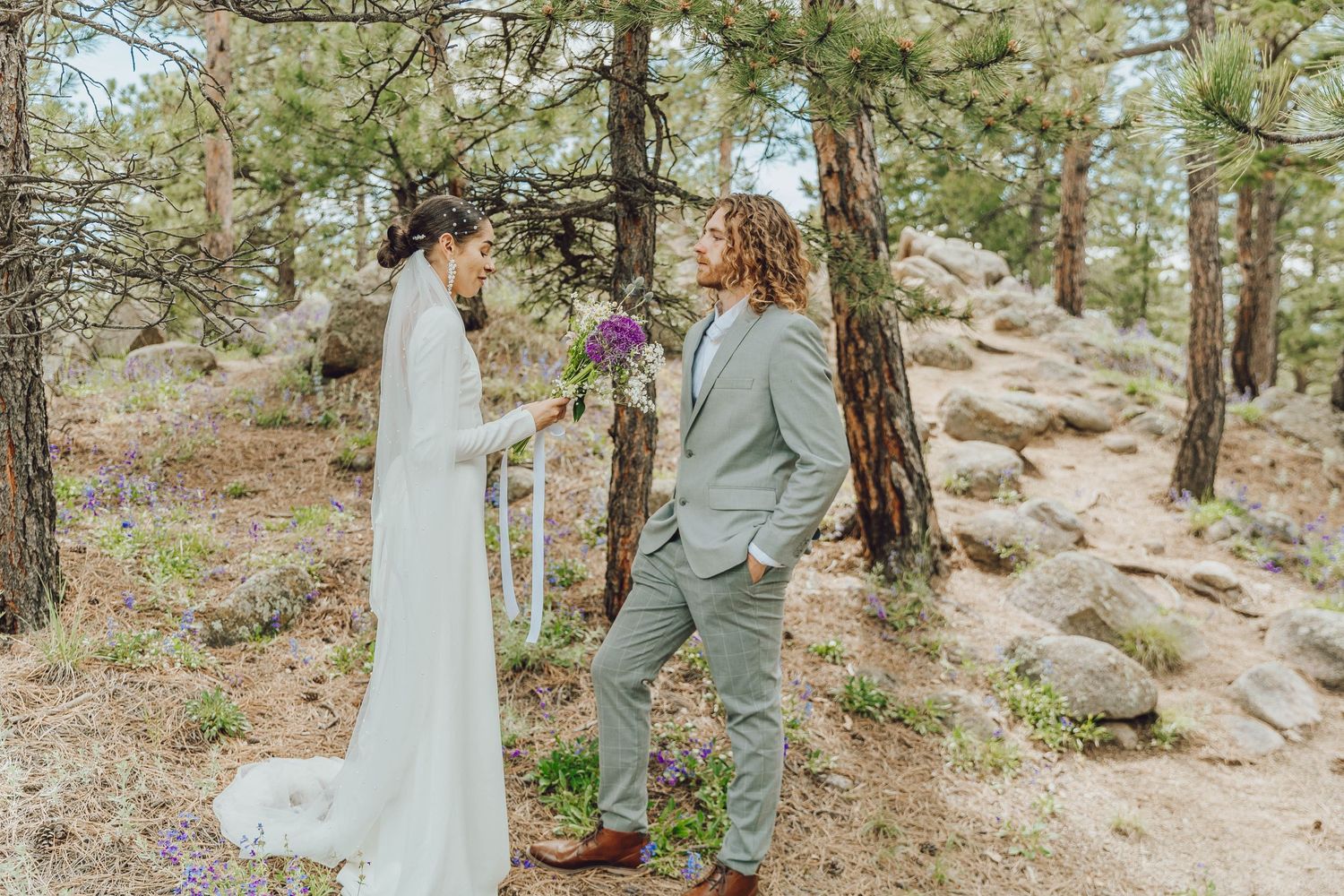 Couple eloping in Colorado surrounded by breathtaking mountain views, vibrant landscapes, and intimate moments