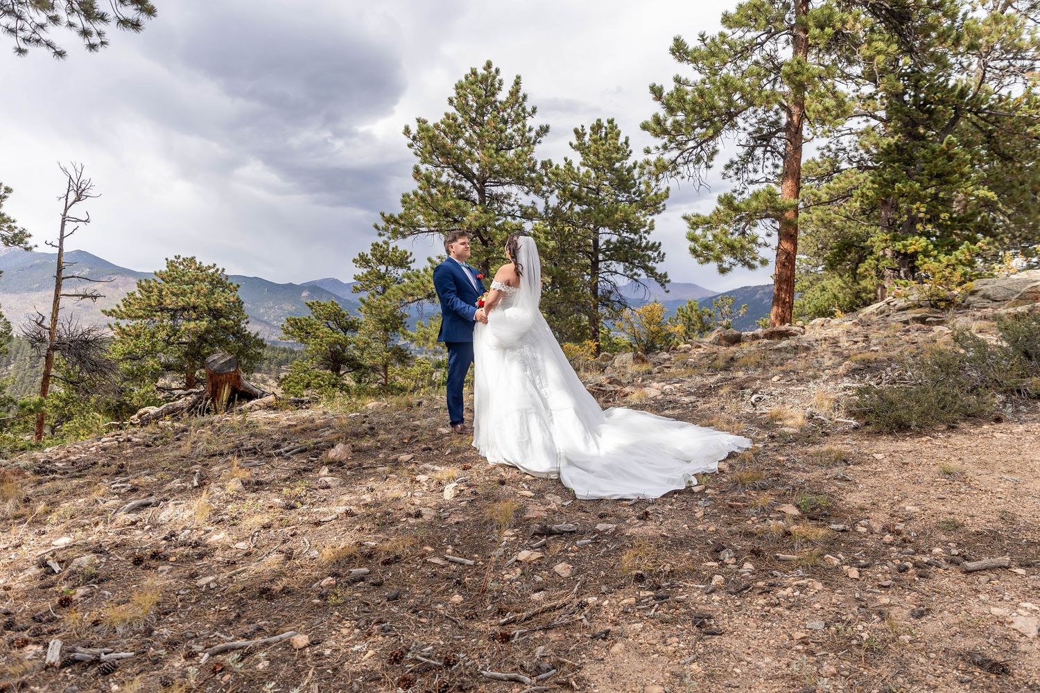 Couple eloping in Colorado surrounded by breathtaking mountain views, vibrant landscapes, and intimate moments