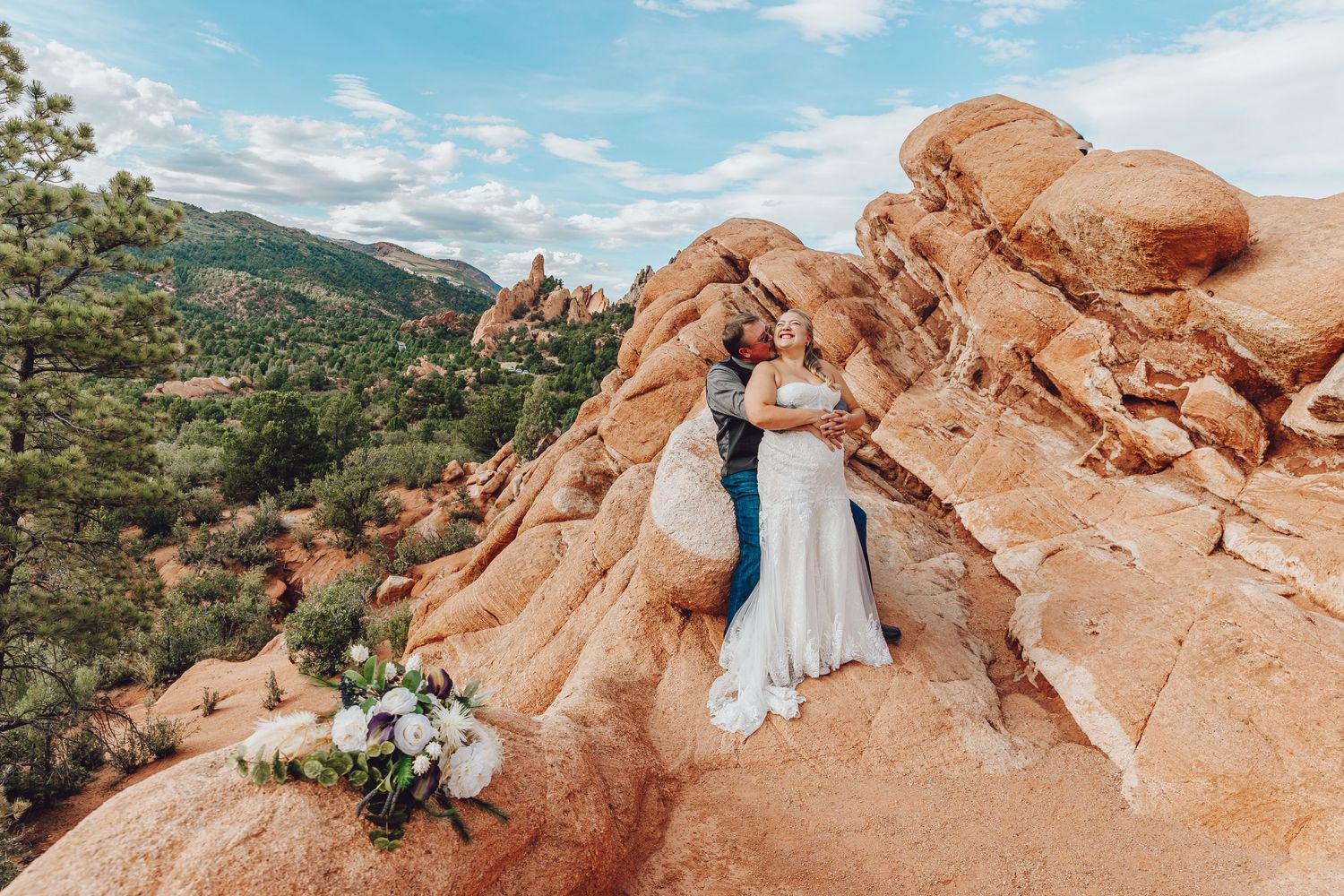 Couple eloping in Colorado surrounded by breathtaking mountain views, vibrant landscapes, and intimate moments