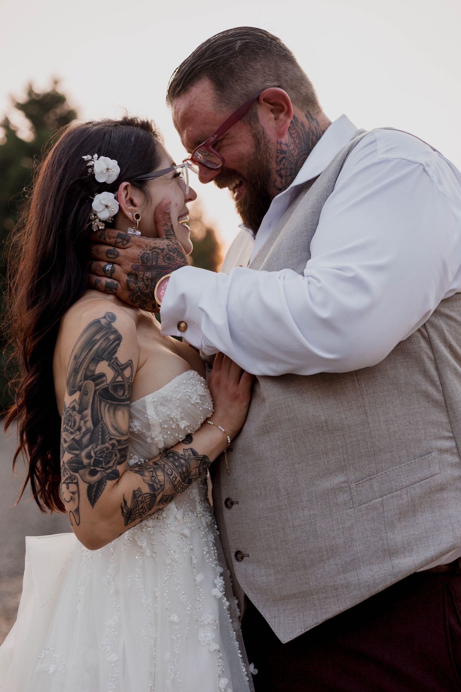 A romantic wedding couple shares tender kisses in a sequence of intimate photos outdoors at sunset.