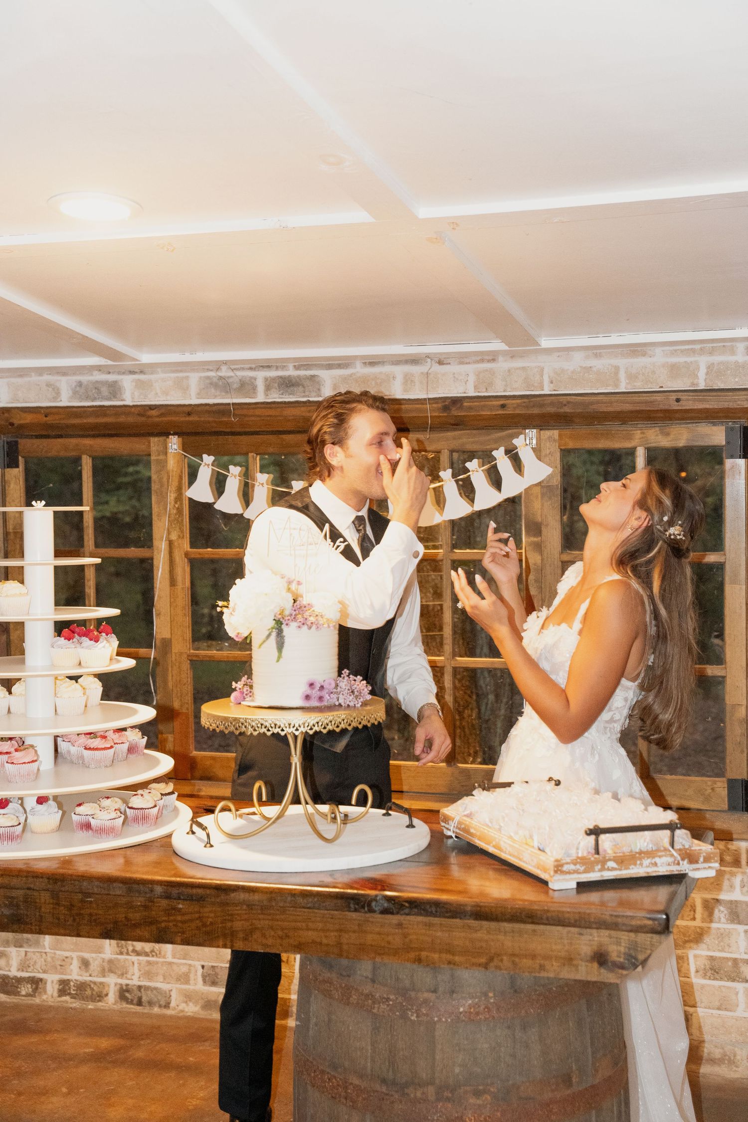 Bride and Groom cutting cake picture. Wedding Photography