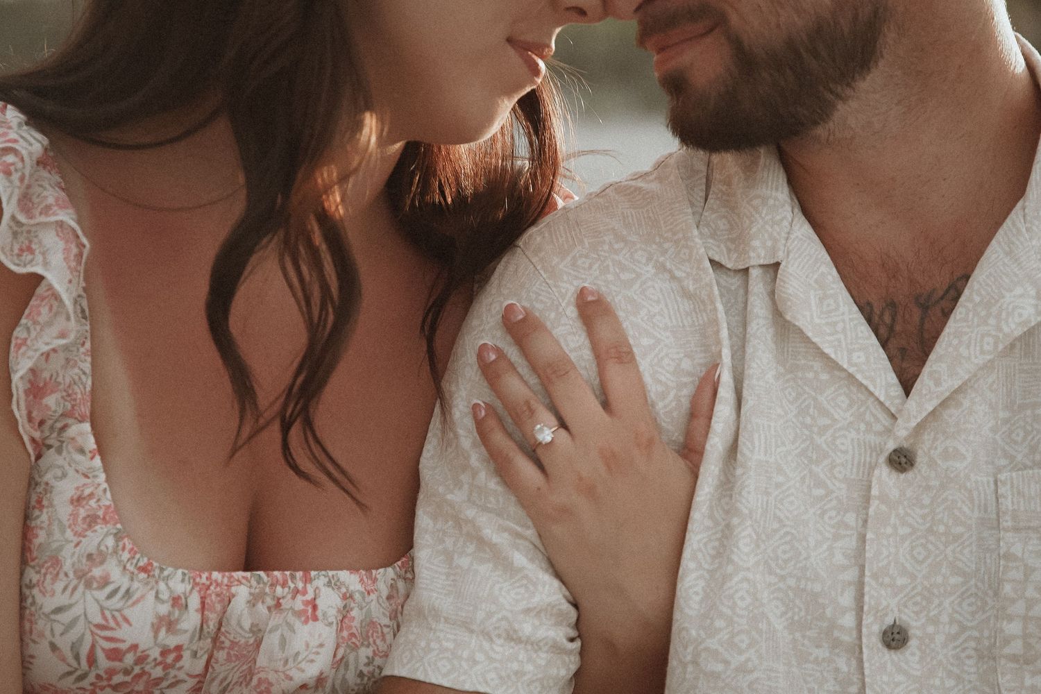 Engaged couple sharing an intimate, quiet moment together during their engagement session.