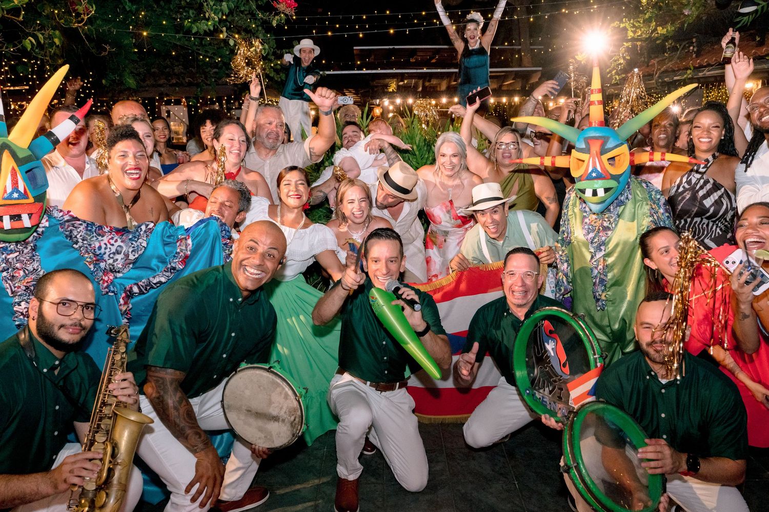 Vibrant carnival celebration with musicians playing saxophone and drums, colorful costumes, and a joyful crowd at a festive outdoor event.