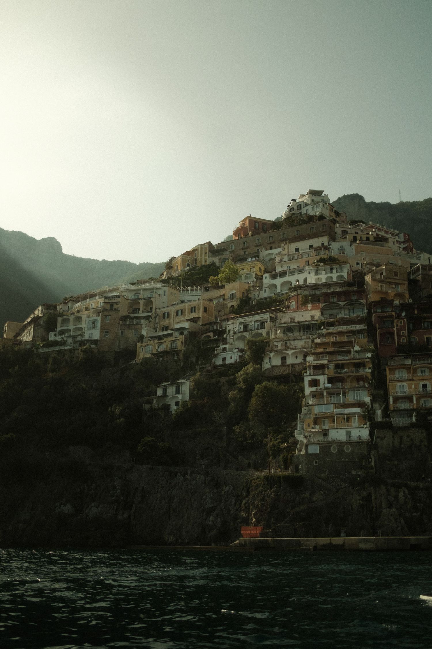 Hillside village of Positano with colorful cliffside buildings overlooking the Mediterranean Sea.