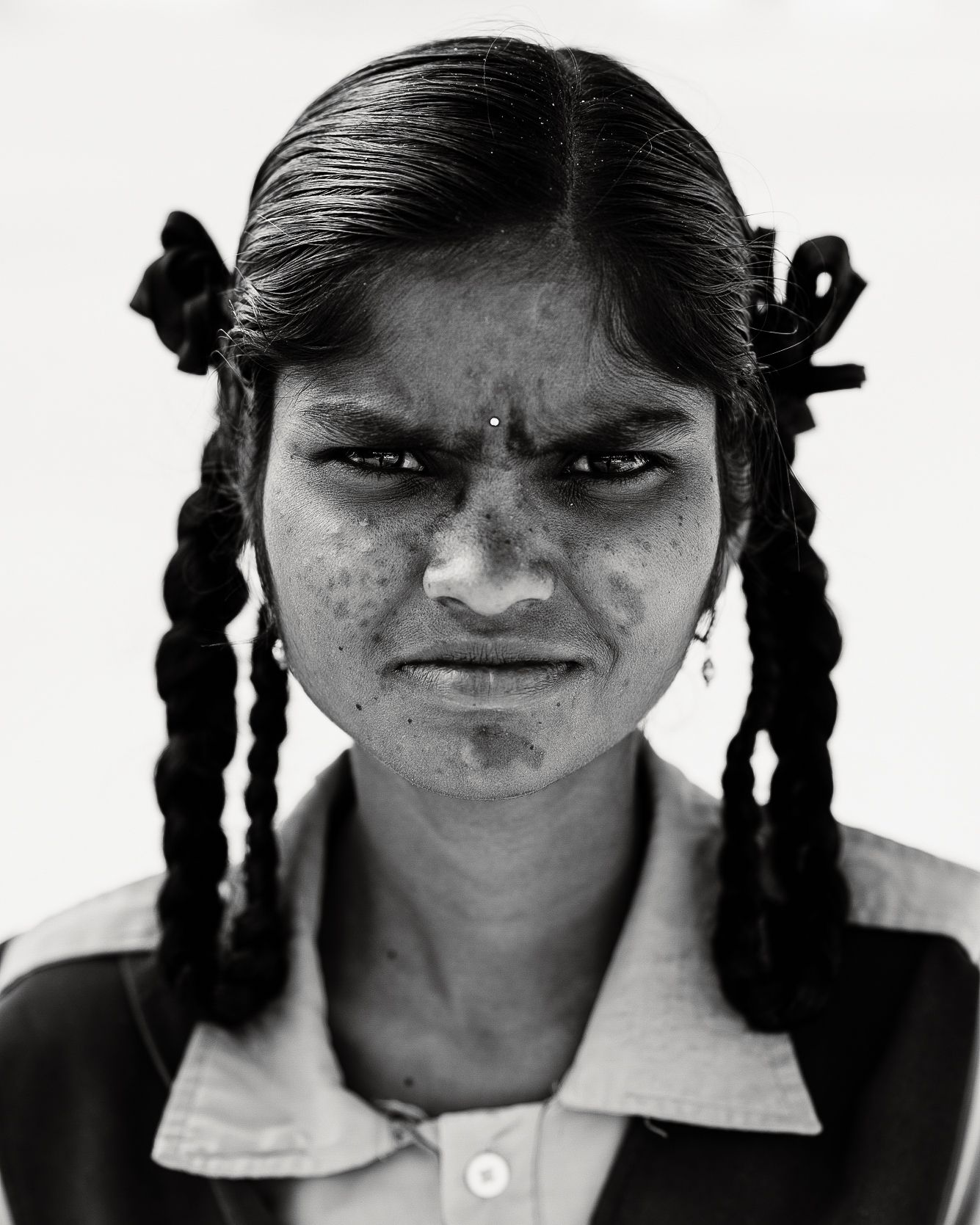 Black-and-white headshot of India students.