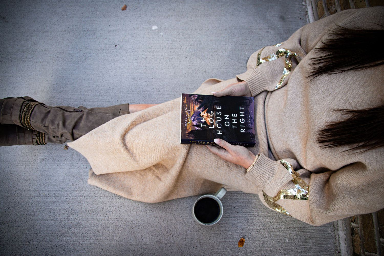Woman holding a book The Log House On The Right