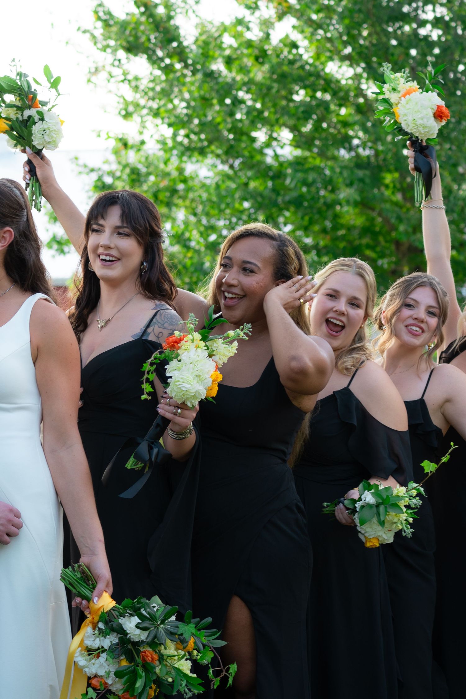 A bridal party cheers on the wedding couple before the ceremony in Scottsville, Virginia.