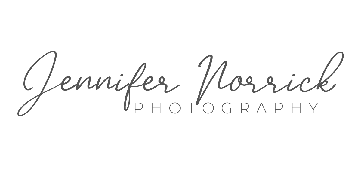 Jennifer Norrick Photography elegant script and serif font professional photography logo on white background.