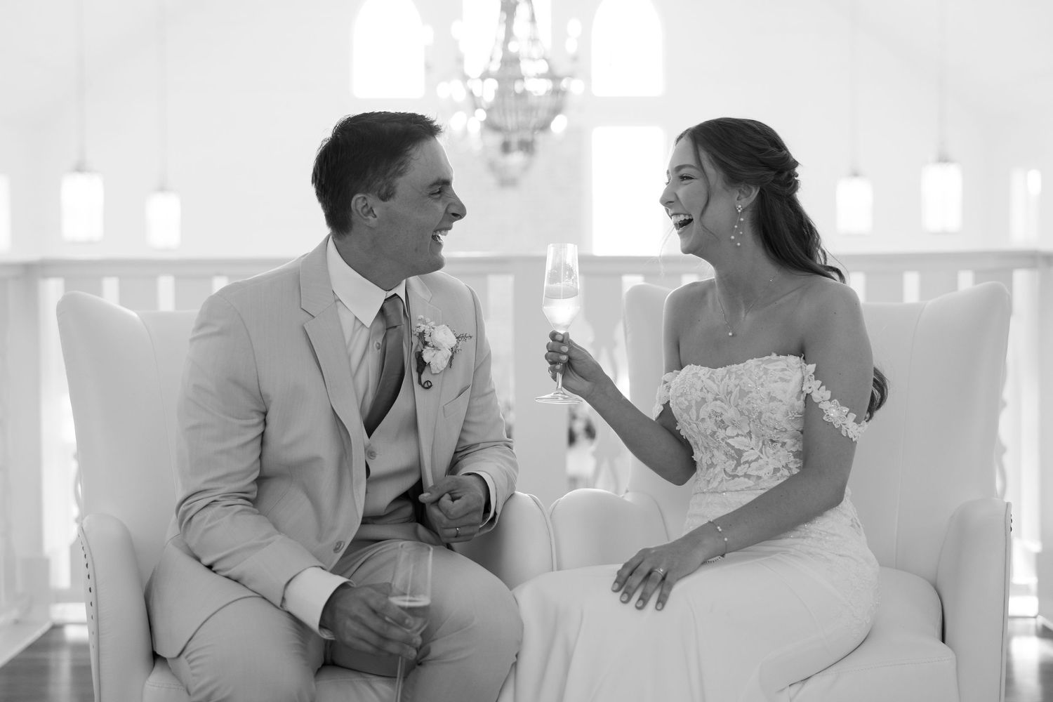 Wedding reception scene in black and white showing celebratory moments.