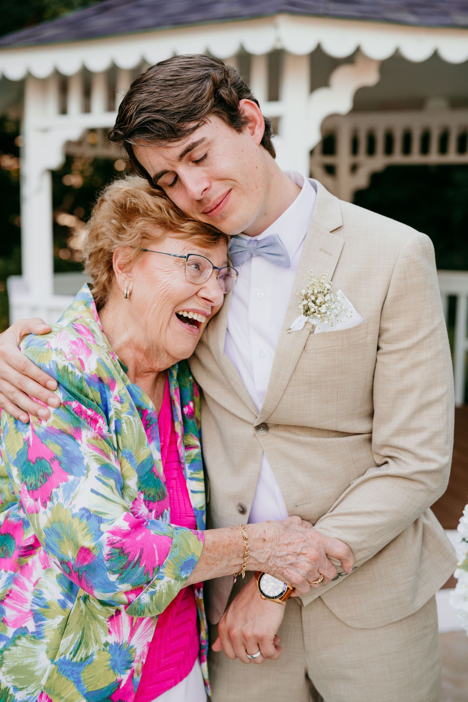 A heartwarming series of photos showing a young man in a beige suit sharing tender moments with an elderly woman in colorful attire.