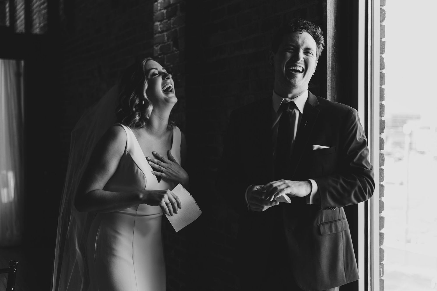 Dramatic black and white candid shots of wedding moments in low light.