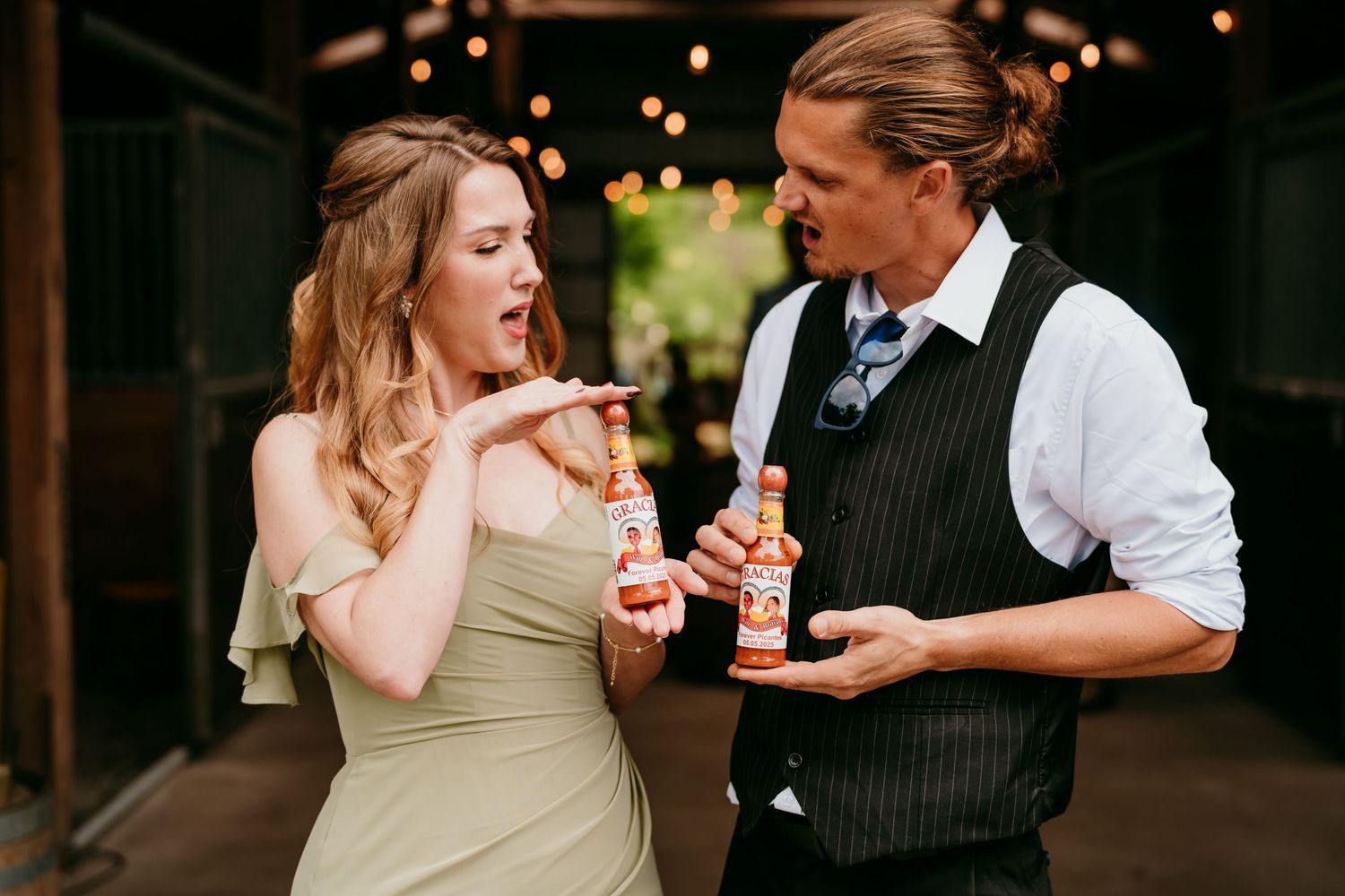 A celebratory wedding reception moment indoors with candlelit ambiance and festive confetti in the air.