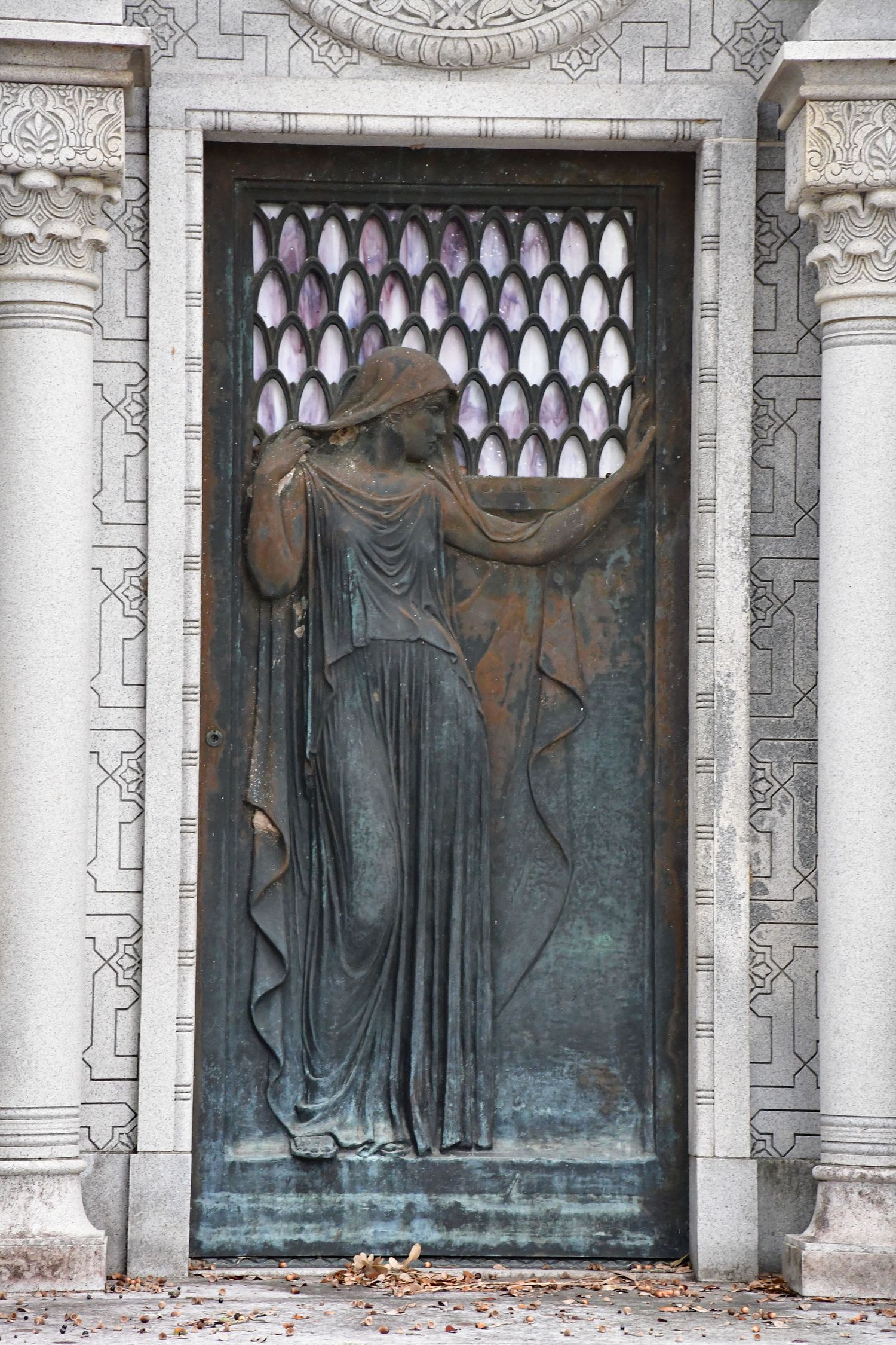 mausoleum door with draped figure