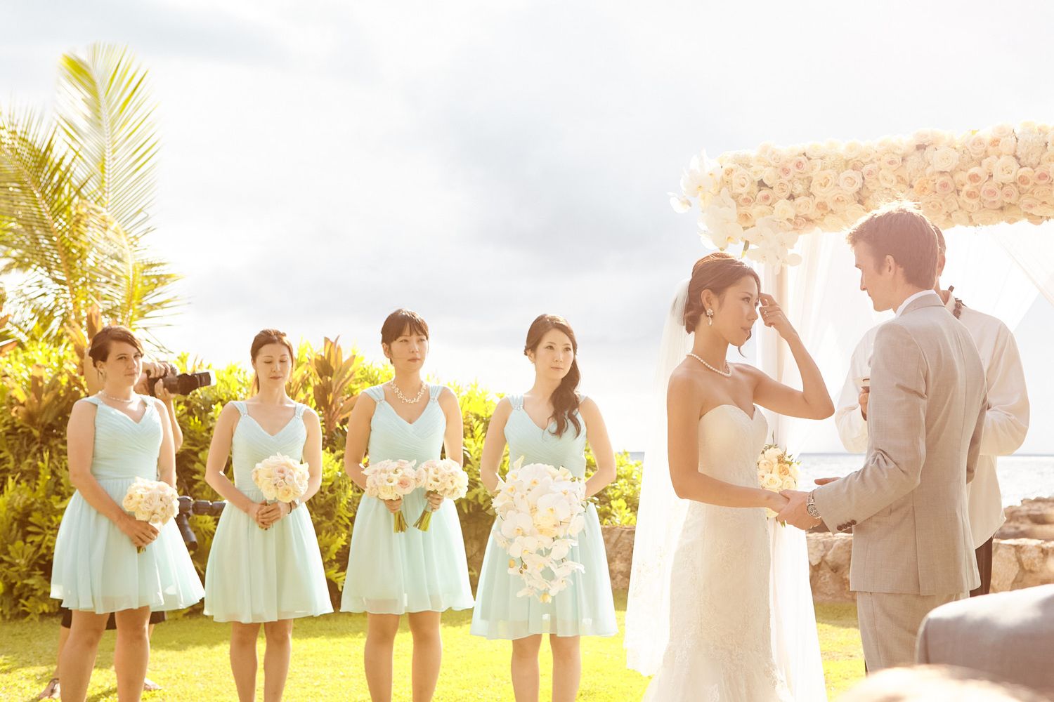 A series of wedding party photos in warm golden sunlight showing bridesmaids in soft blue dresses.