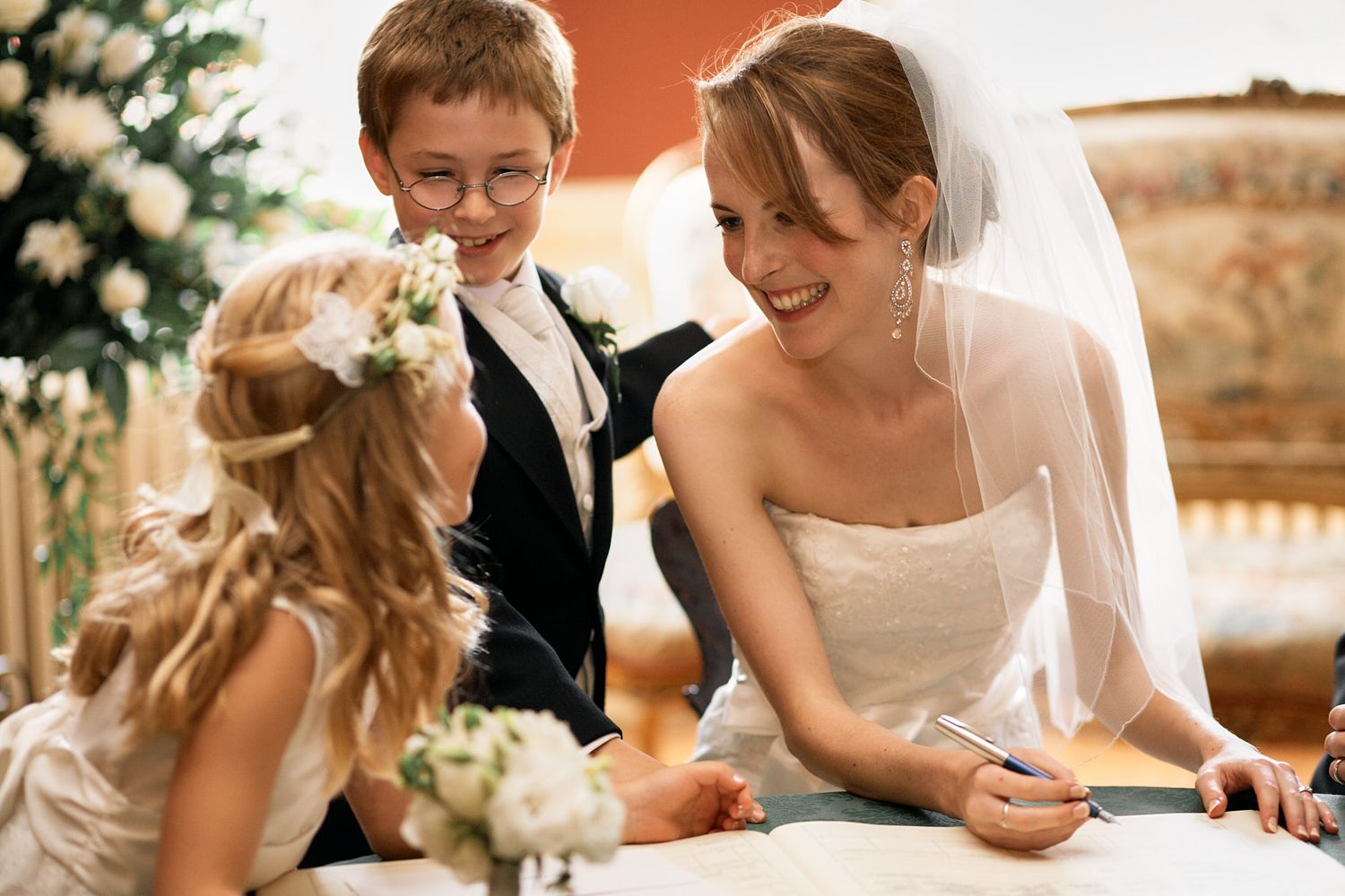 Wedding party seated at an elegant dinner table enjoying conversation in Blackheath, London.