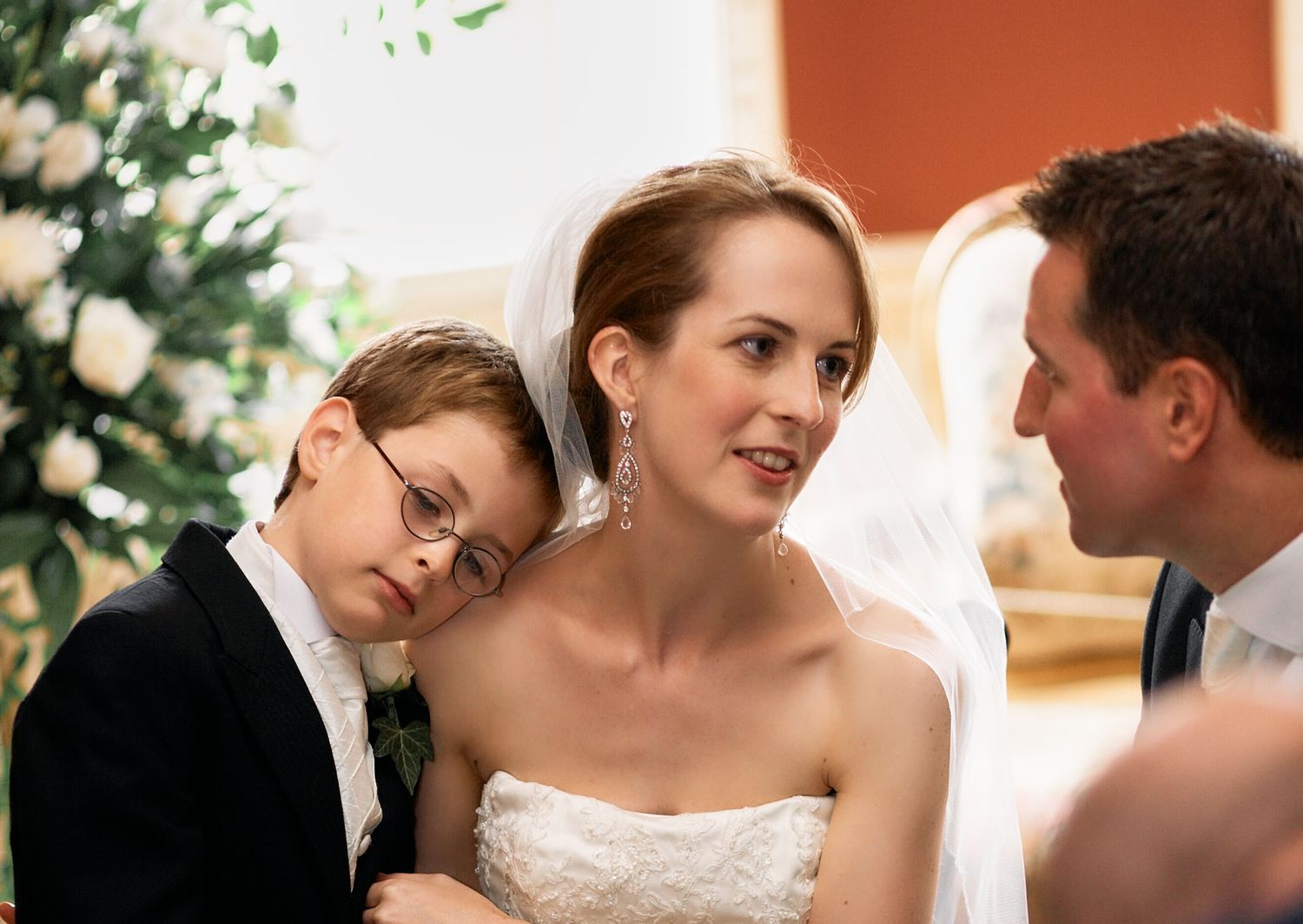 Wedding party gathered around a dining table in an elegant setting in Blackheath, London.