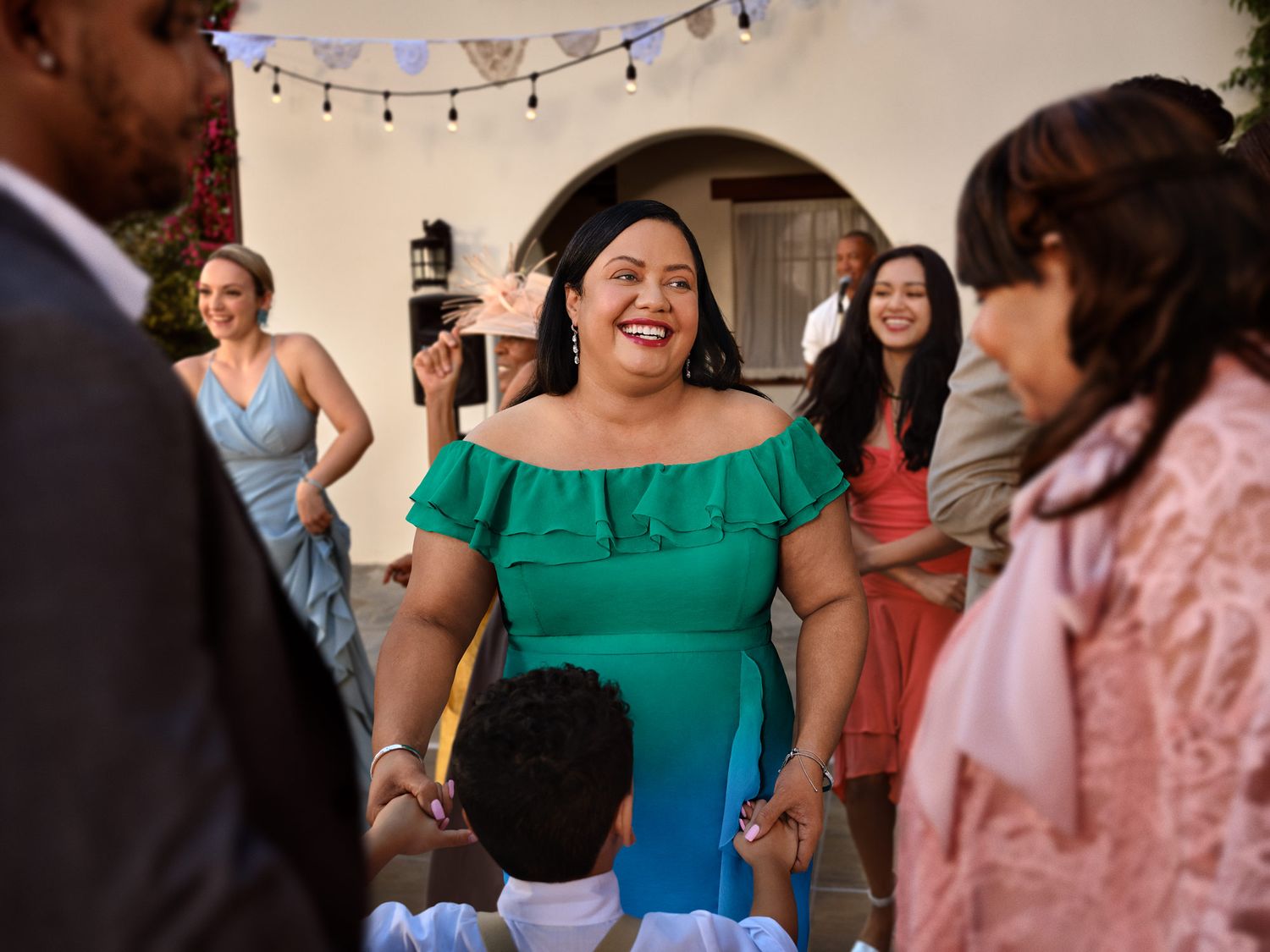 Wedding reception party with festive string lights and guests dancing in Los Angeles.
