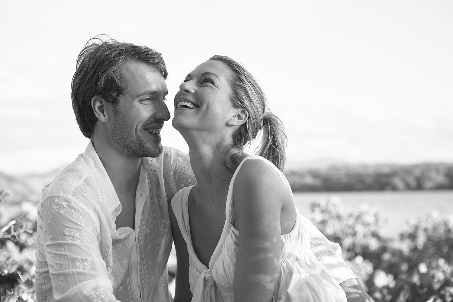 Candid black and white series of romantic couple sharing intimate moments.