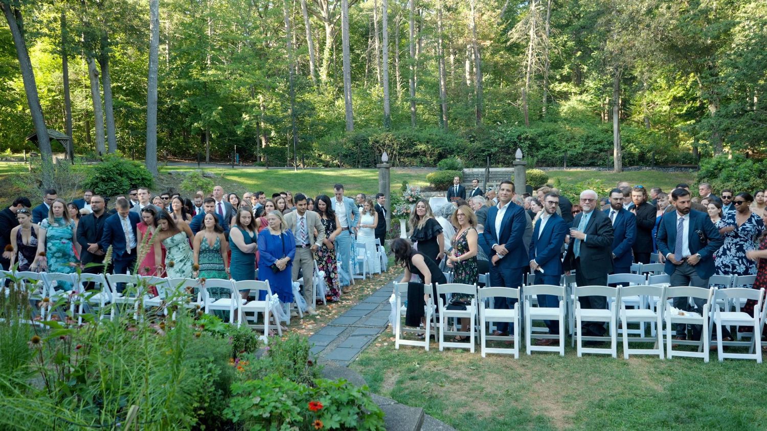 Guests awaiting bride during outdoor Arrow Park wedding ceremony.