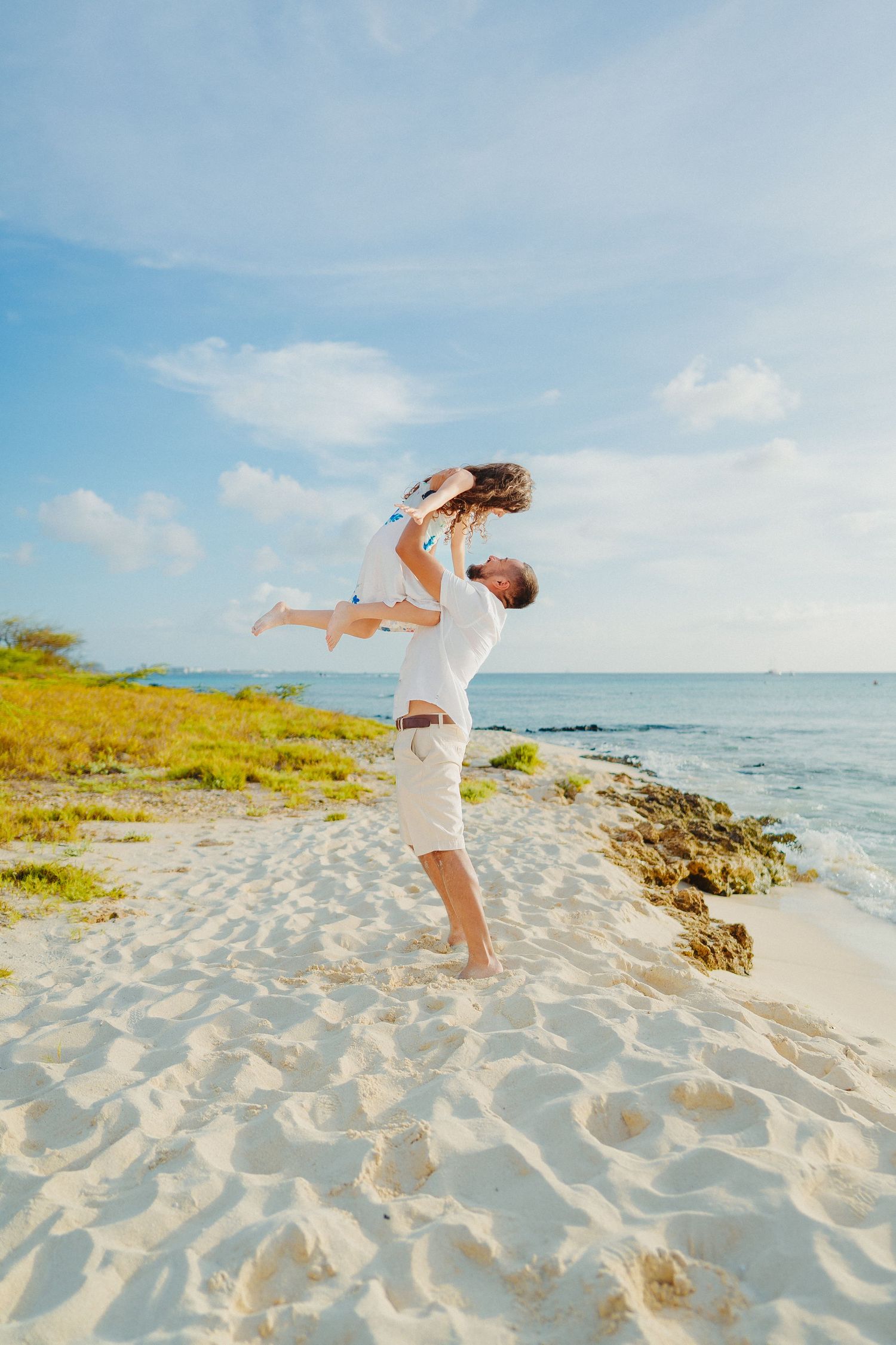 A sequence of backflip photos on a sunny beach shows an acrobatic movement against a backdrop of sand and ocean.