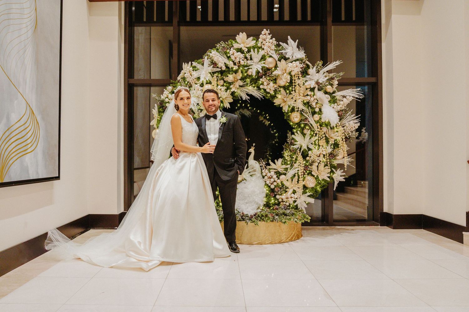 A series of wedding photos showing elegant white floral arrangements and formal attire in an indoor venue.