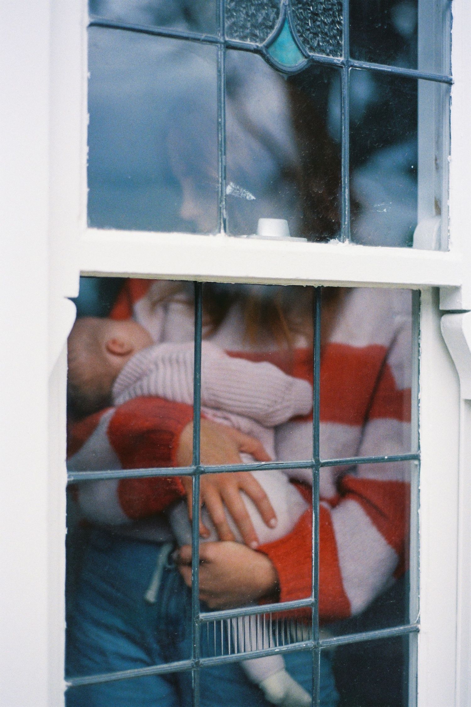 Mum and baby through the window. Mornington-Peninsula and Melbourne Film Photography
