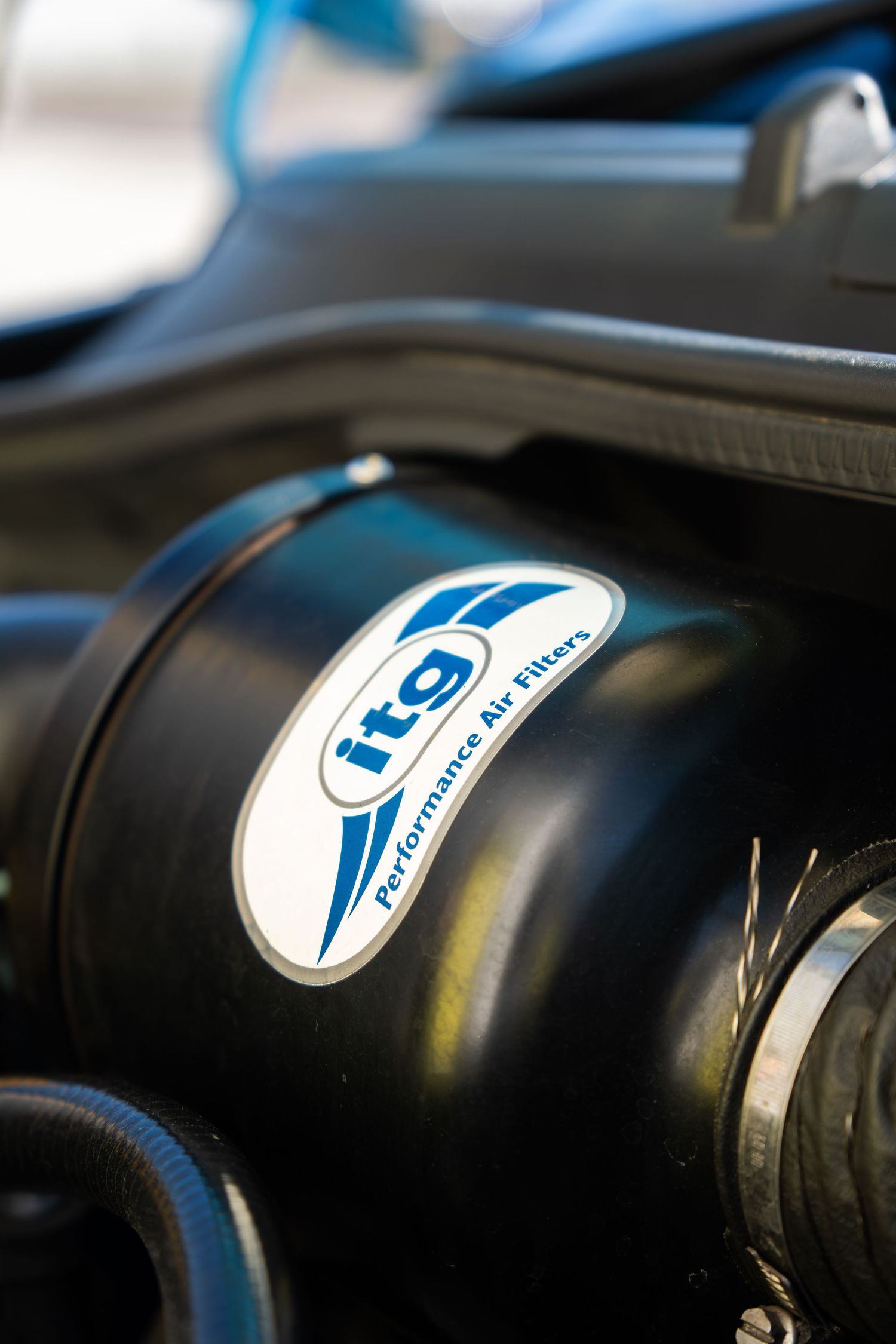 ITG Performance Air Filters induction kit installed in blue Abarth 500 engine bay.