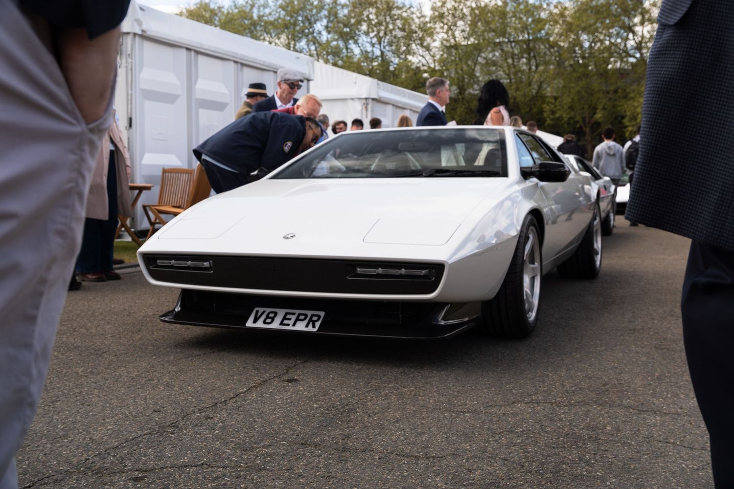 Classic white Lamborghini Urraco with UK license plate V8 EPR at an outdoor car show.
