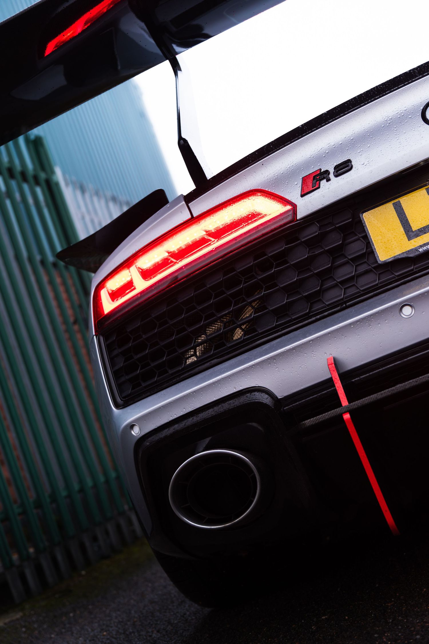 Close-up of Audi R8 GT3 rear taillight and exhaust detail shot.