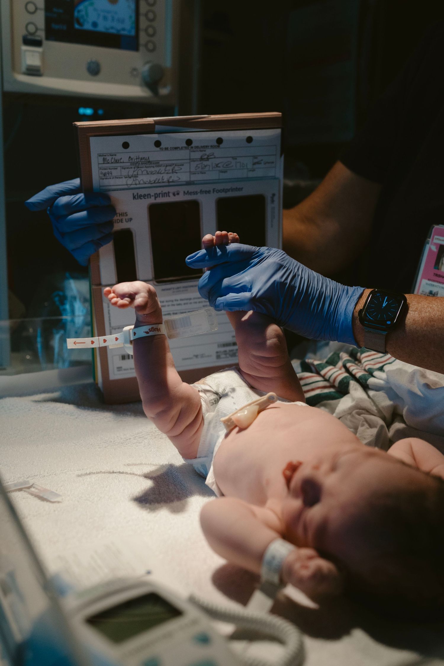 Birth photography documenting newborn footprints