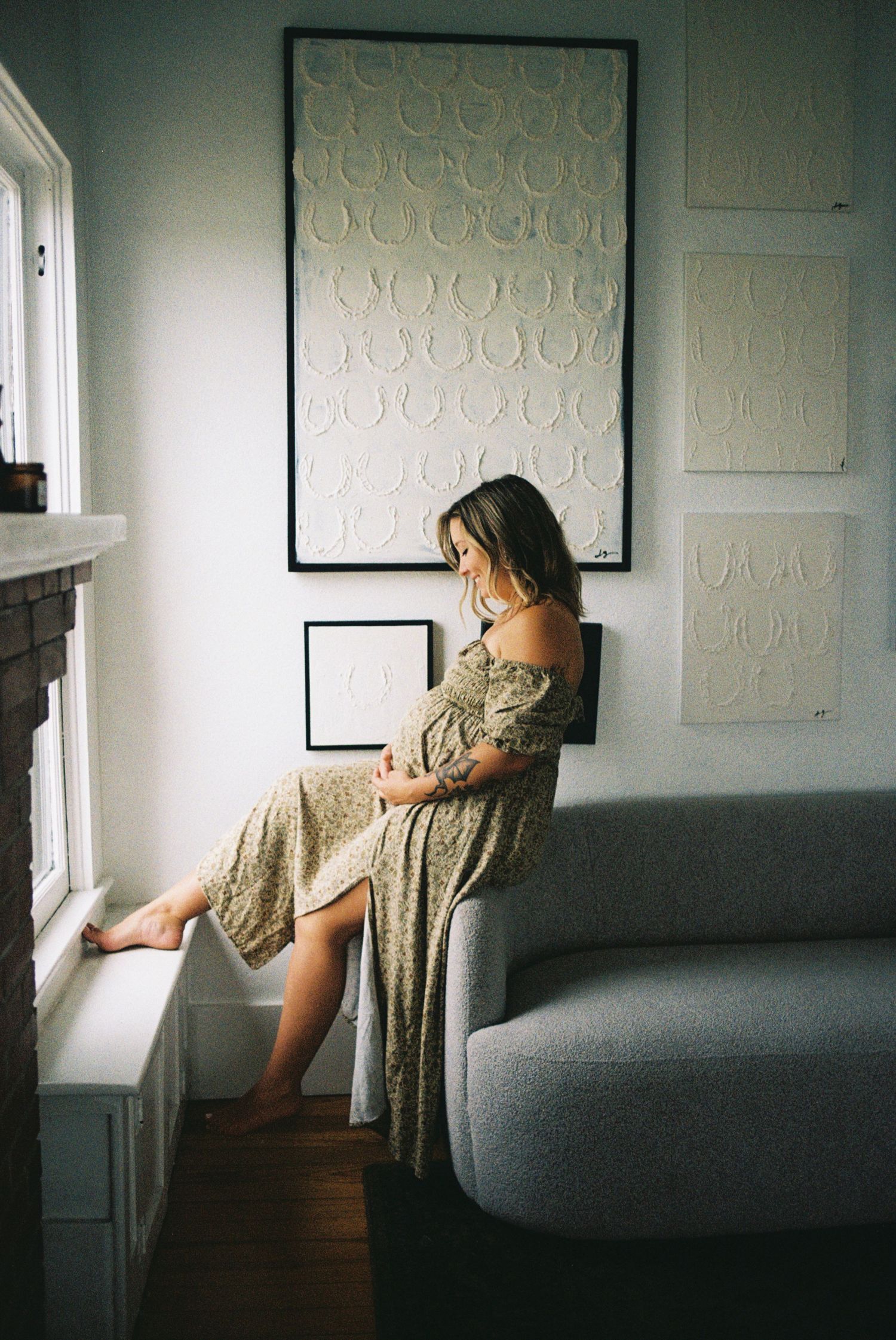 A series of artistic photographs showing a person in a patterned dress near a window in moody lighting.