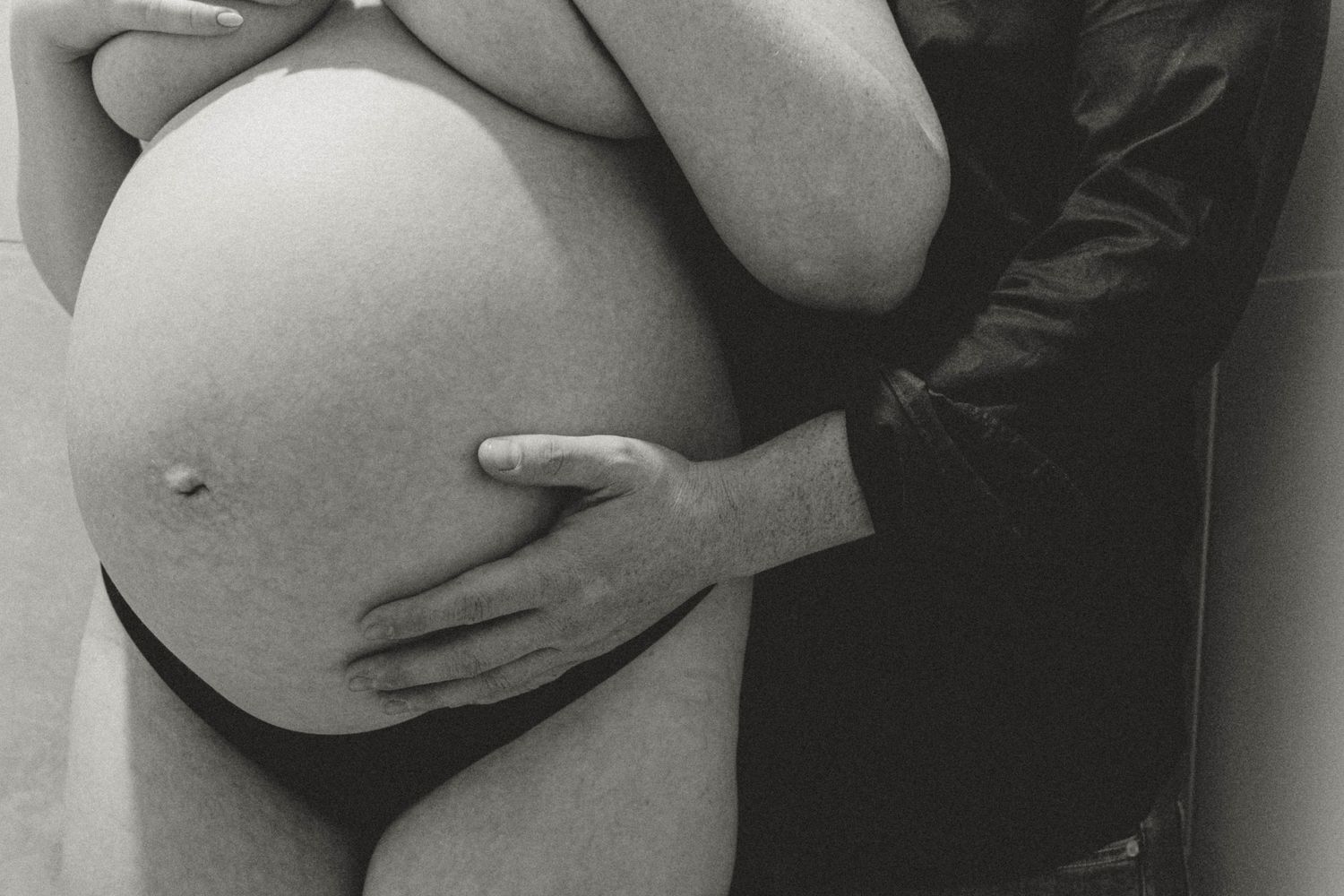 Pregnant woman and partner, close up